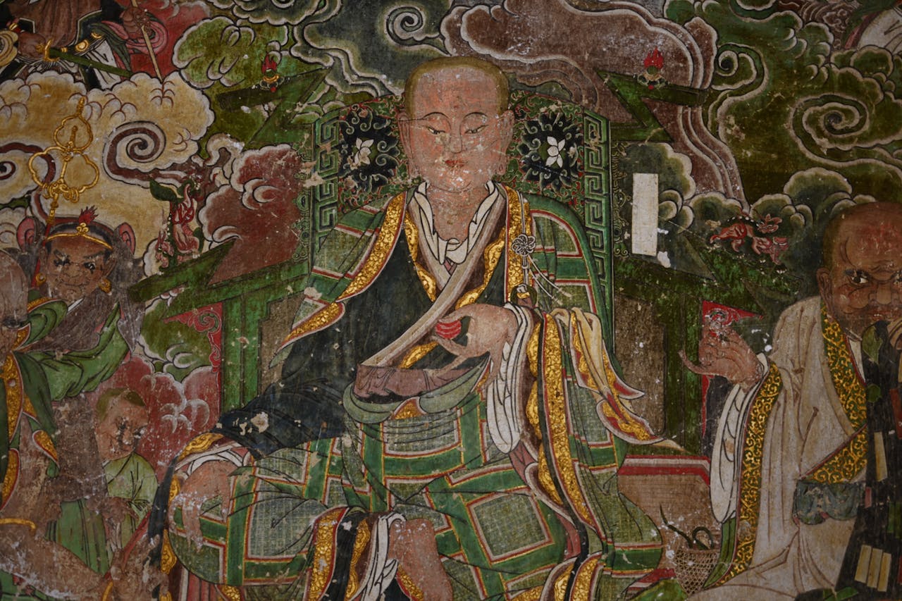 Kodu Detailed mural showcasing ancient Asian monks among clouds and mythical figures, rich in symbolism.
